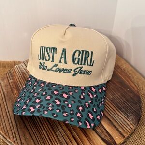 New Just A Girl Who Loves Jesus Embroidered Trucker Hat in Multi Cougar and tan